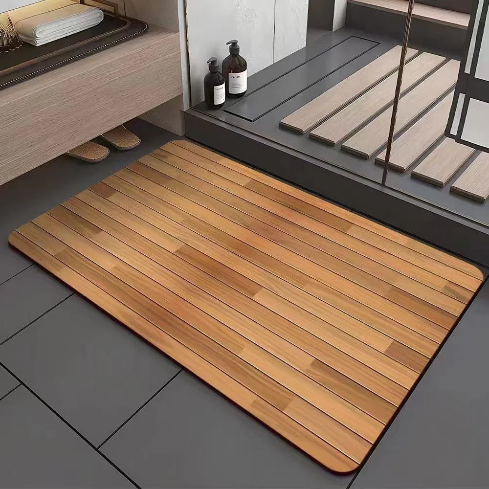 Square diatomite bathroom floor mat with wood grain geometric pattern on a bathroom floor.