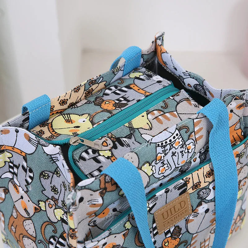 Women's printed canvas handbag with aluminium hardware in horizontal square shape