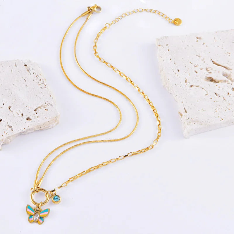 Gold epoxy butterfly jewellery set with necklace and bracelet on titanium steel snake bone chain