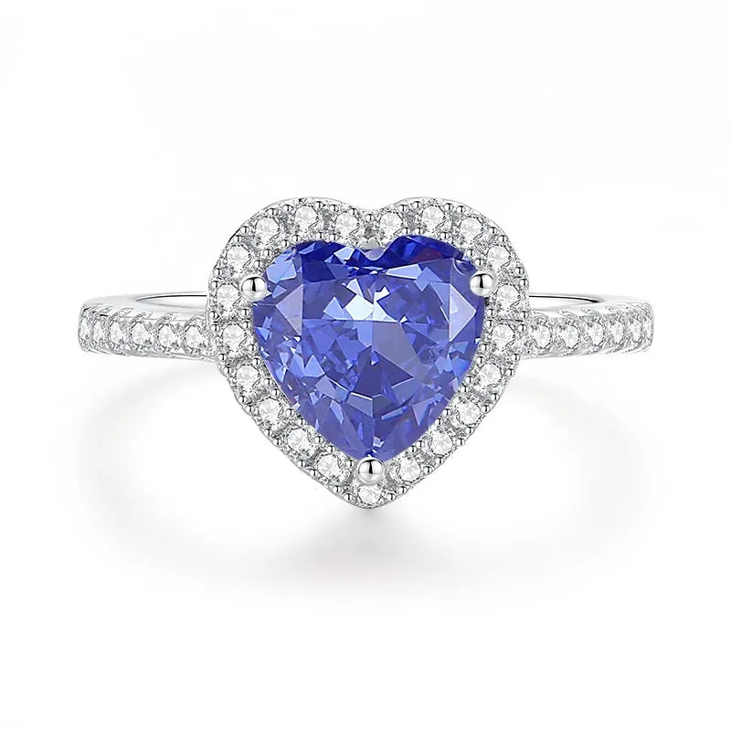 Heart-shaped sterling silver ring with a faceted ice flower cut zircon stone in a Tanzanite colour.