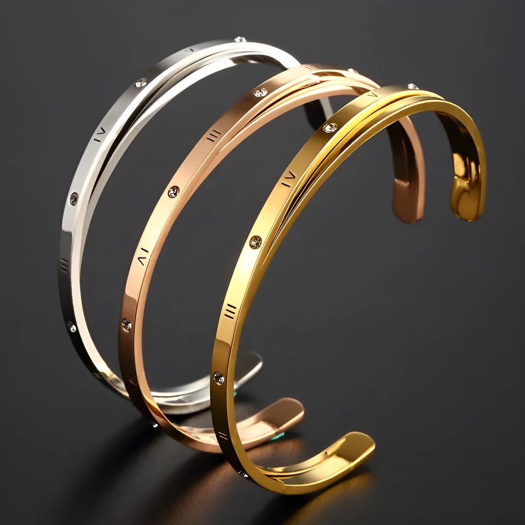Open-ended stainless steel bracelet with zircon stones in rose gold colour