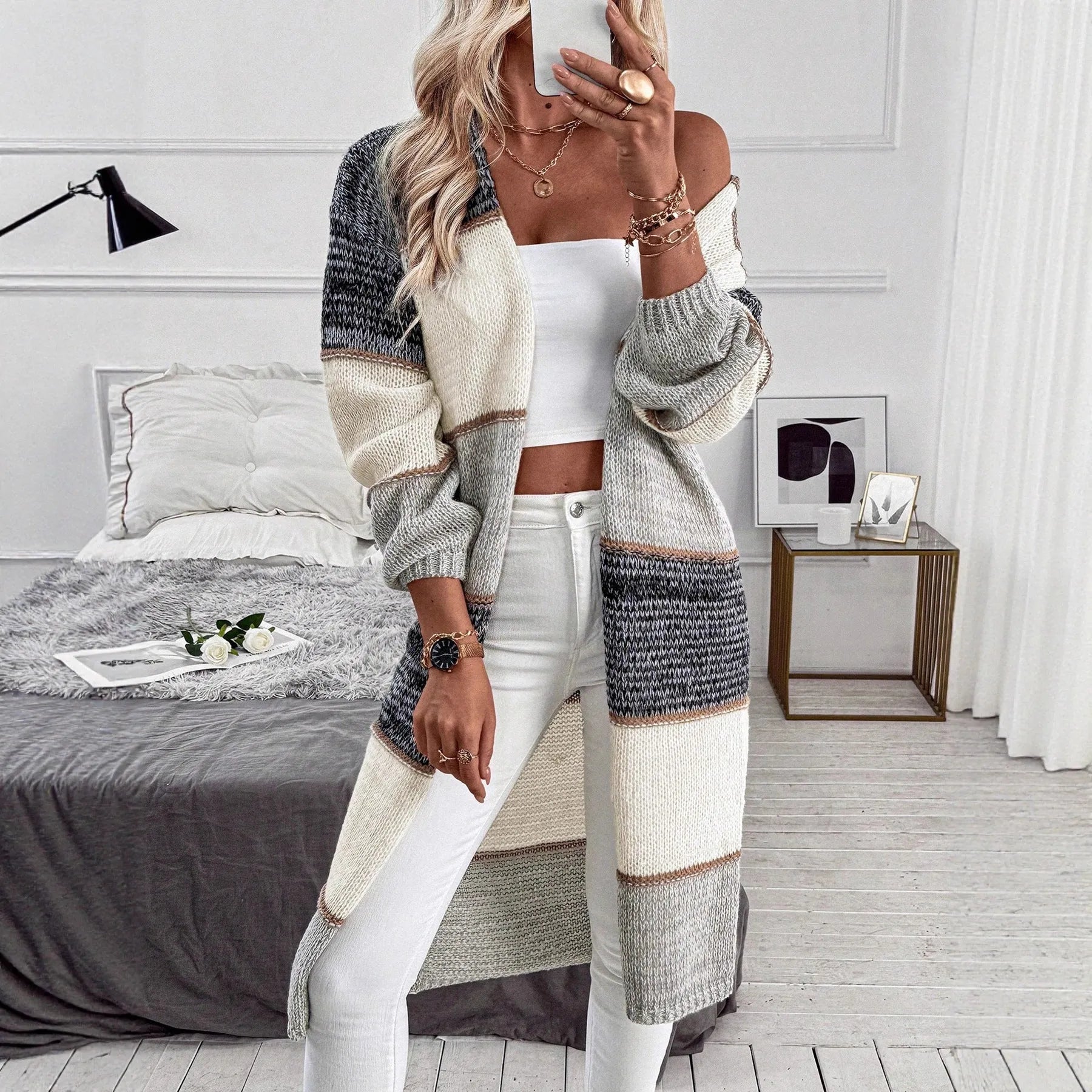 Grey striped loose fit long cardigan for women on a hanger
