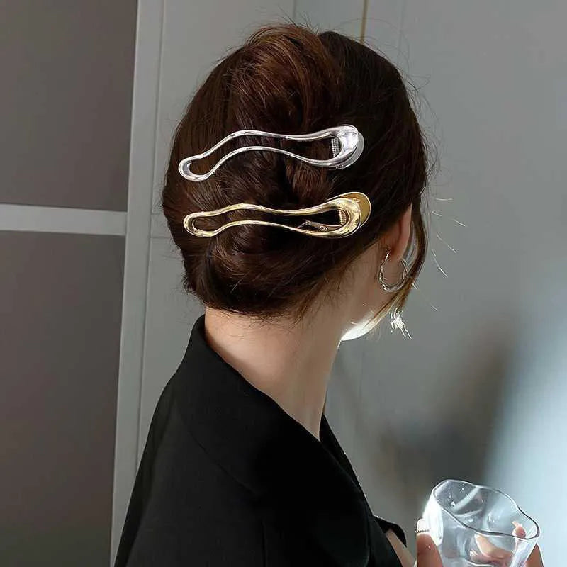 Women's zinc alloy hair barrettes in gold and silver colours showing square, arc, and triangle shapes