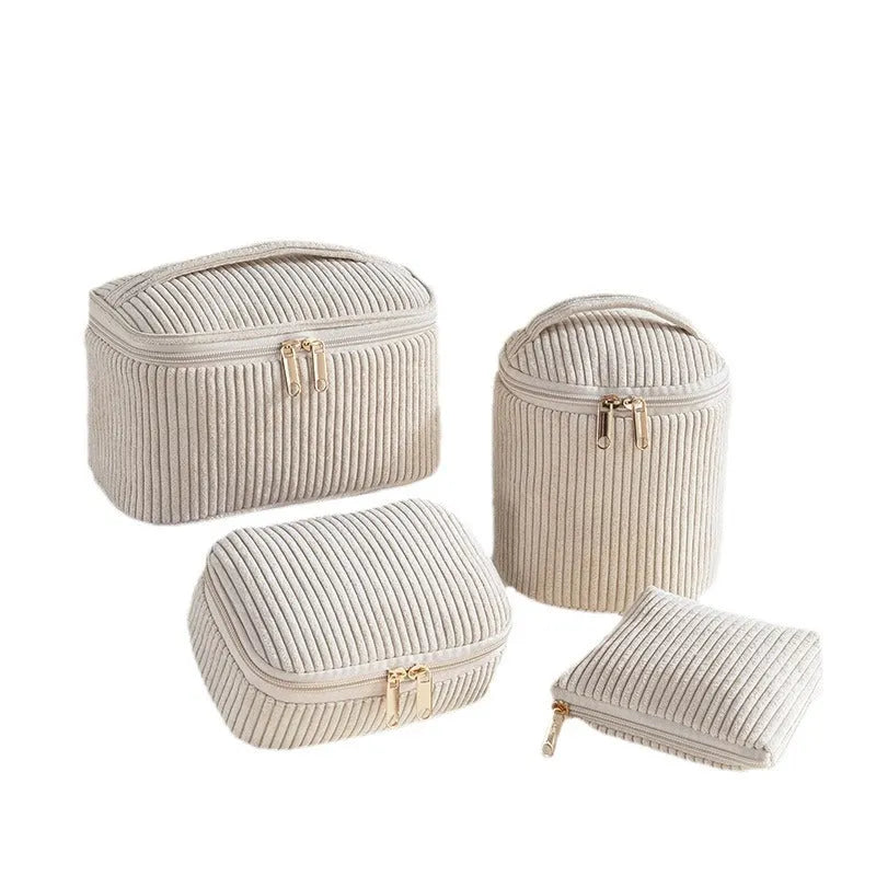 Four cube-style flannelette makeup bags in different colours: pink, khaki, pink dots, and blue with dots