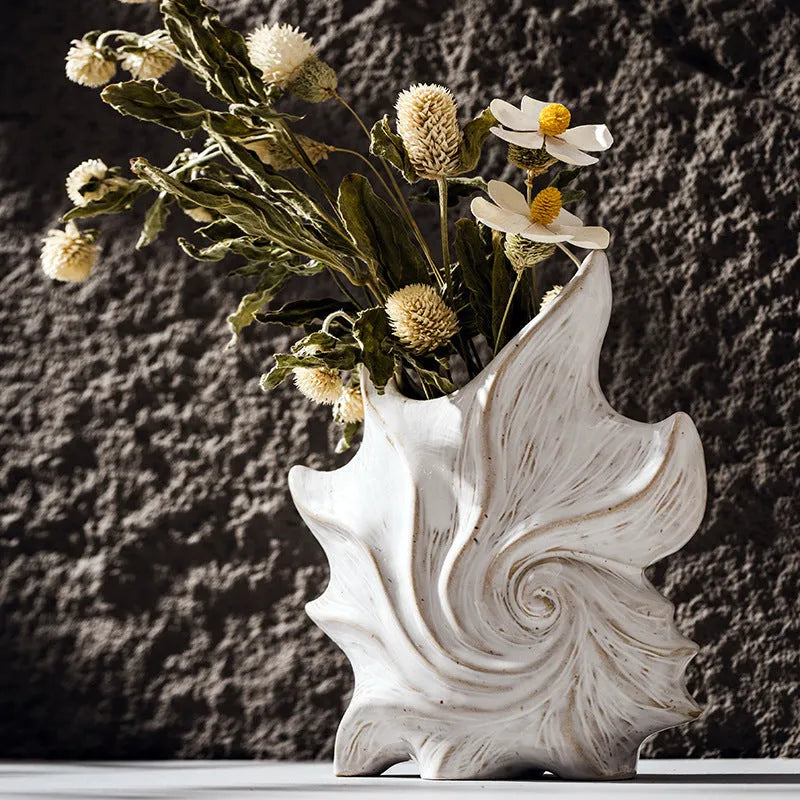European retro style ceramic vase with a coloured glaze finish on a wooden table.