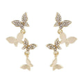 Women's gold-coloured copper earrings with four butterfly design elements in drop style