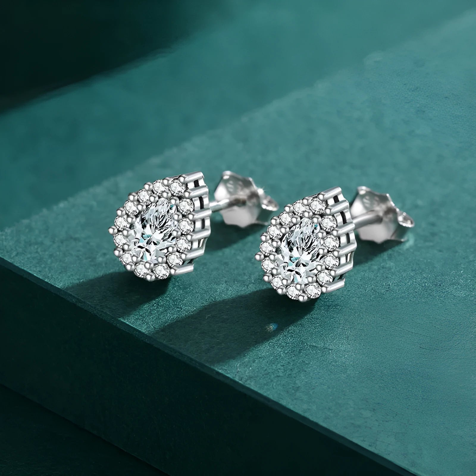 Women's silver drop ear studs with diamond cut treatment in water drop shape