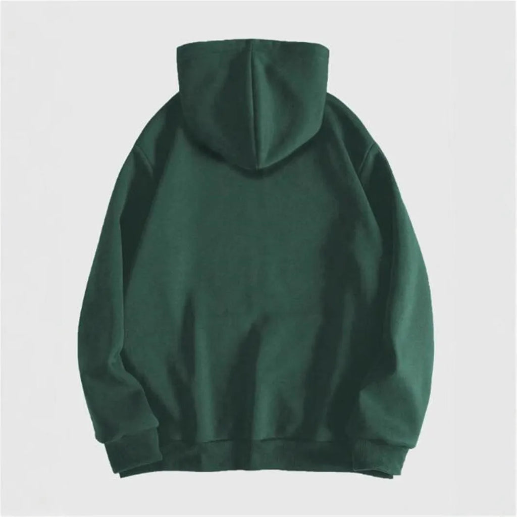 Man wearing a black hooded sweatshirt with a large green skull graphic print on the front.