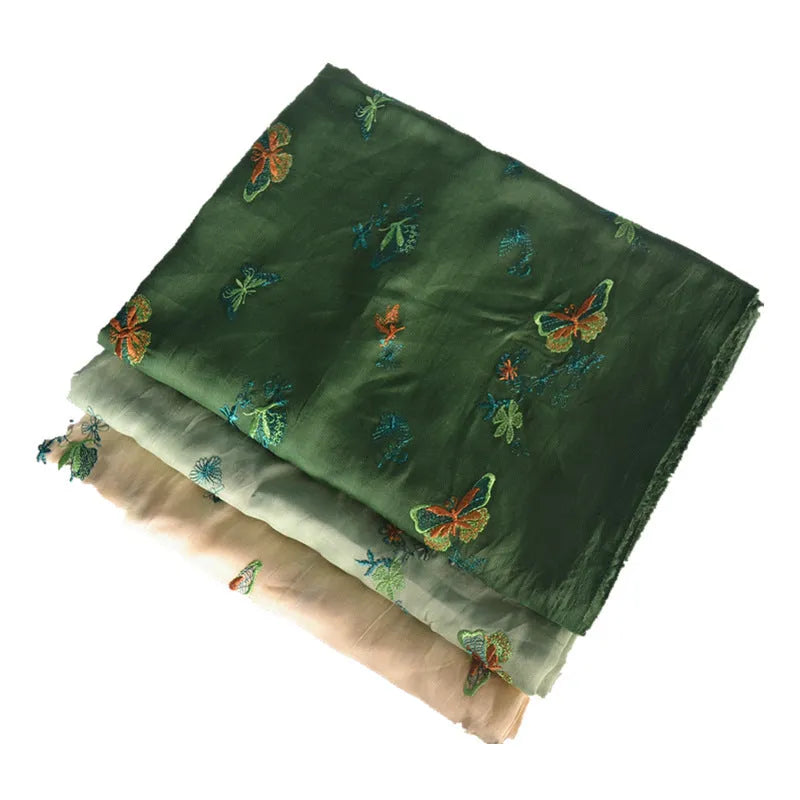 Pure ramie fabric for hanfu in beige, grass green, and dark green colours, showing texture.