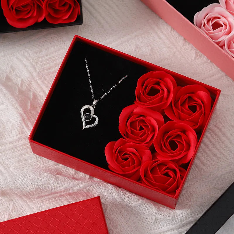 Six scented soap flowers in red pink or black inside a gift box with matching handbag