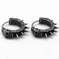 A pair of black alloy punk-style earrings shaped like geometric motorcycles.