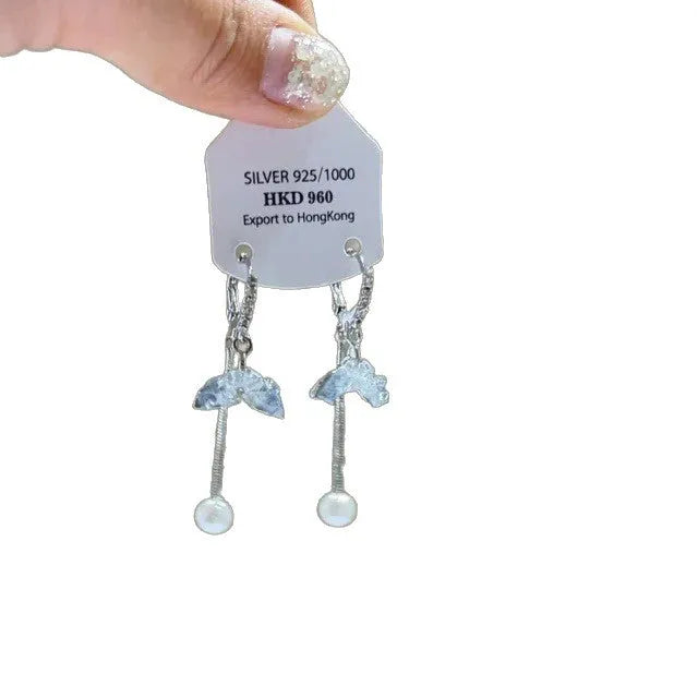 Women's geometric heart-shaped earrings with rhinestones and a dangling tassel, shown in silver tone.