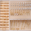 108 geometric pearl earrings with gold and yellow electroplated finishes on alloy construction