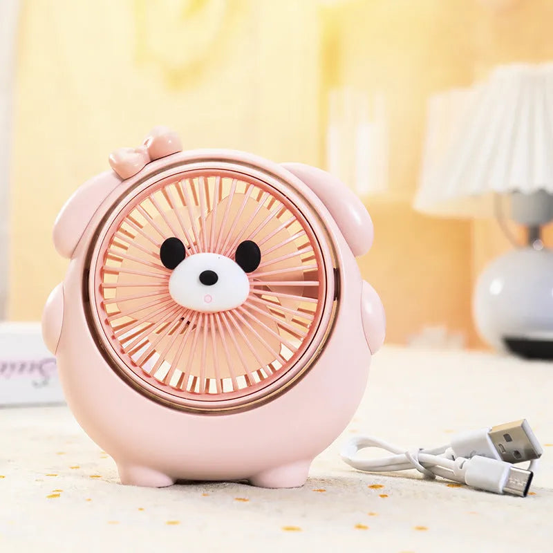 A Bear Brown coloured desktop USB electric fan for dogs on a wooden table.