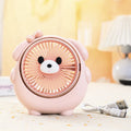 A Bear Brown coloured desktop USB electric fan for dogs on a wooden table.