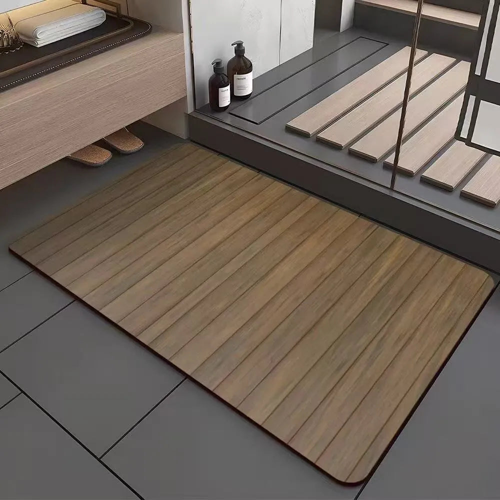 Square diatomite bathroom floor mat with wood grain geometric pattern on a bathroom floor.