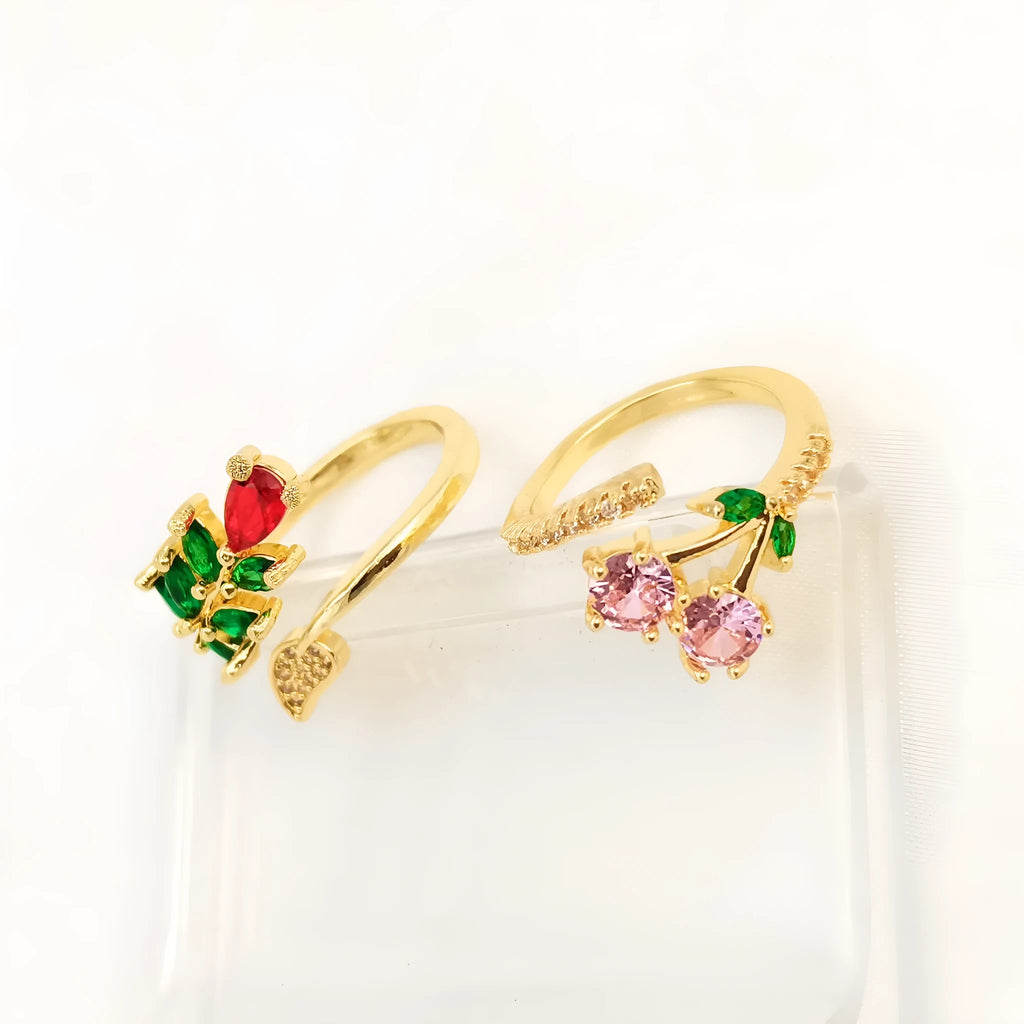 Copper geometric open ring with gold zircon plating and micro-inlaid leaf design, shown in two colours.