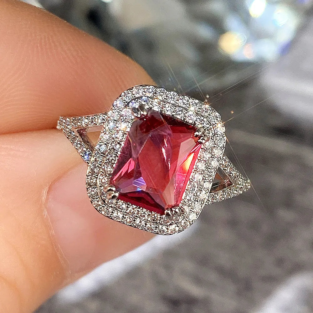 Copper geometric square ring with red rhinestones for women, showing structured design and sparkling accents