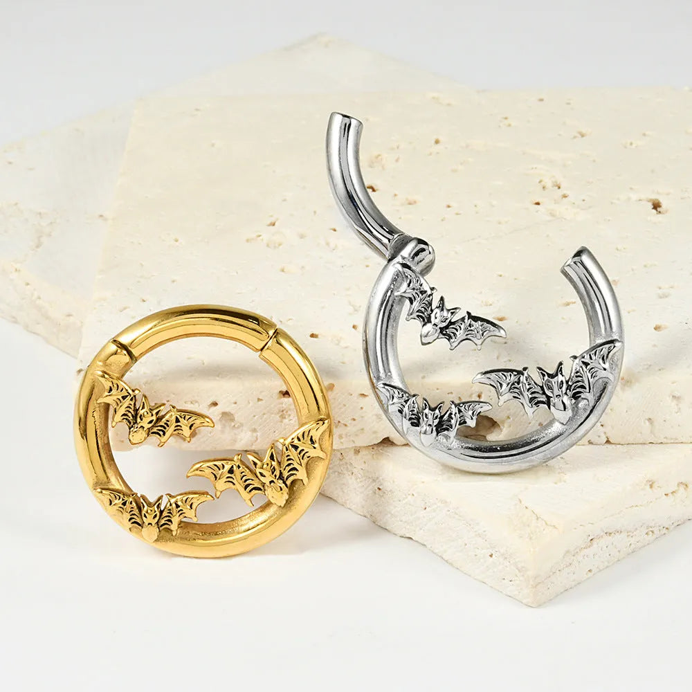 A pair of silver totem pattern fashion earrings made from stainless steel with an electroplated finish.