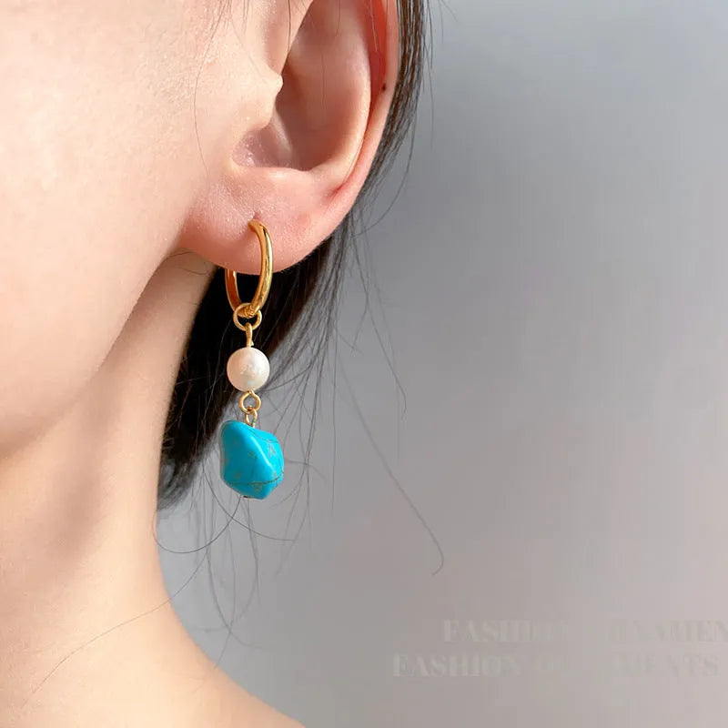 Geometric turquoise and cultured pearl ear clip set with irregular design in short and dangle styles