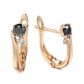 Women's gold drop earrings with black agate geometric design and clip-on back