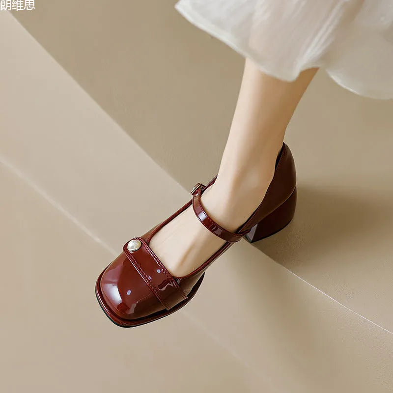 French style hiking boots with patent leather upper, chunky block heel, and buckle fastening in apricot colour