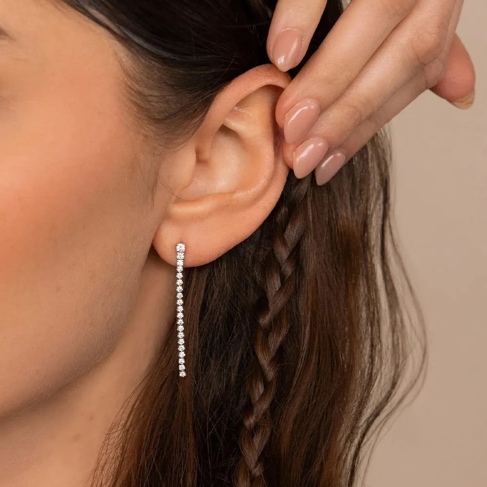 A pair of women's geometric stainless steel earrings with zircon detail in gold and steel colour options.