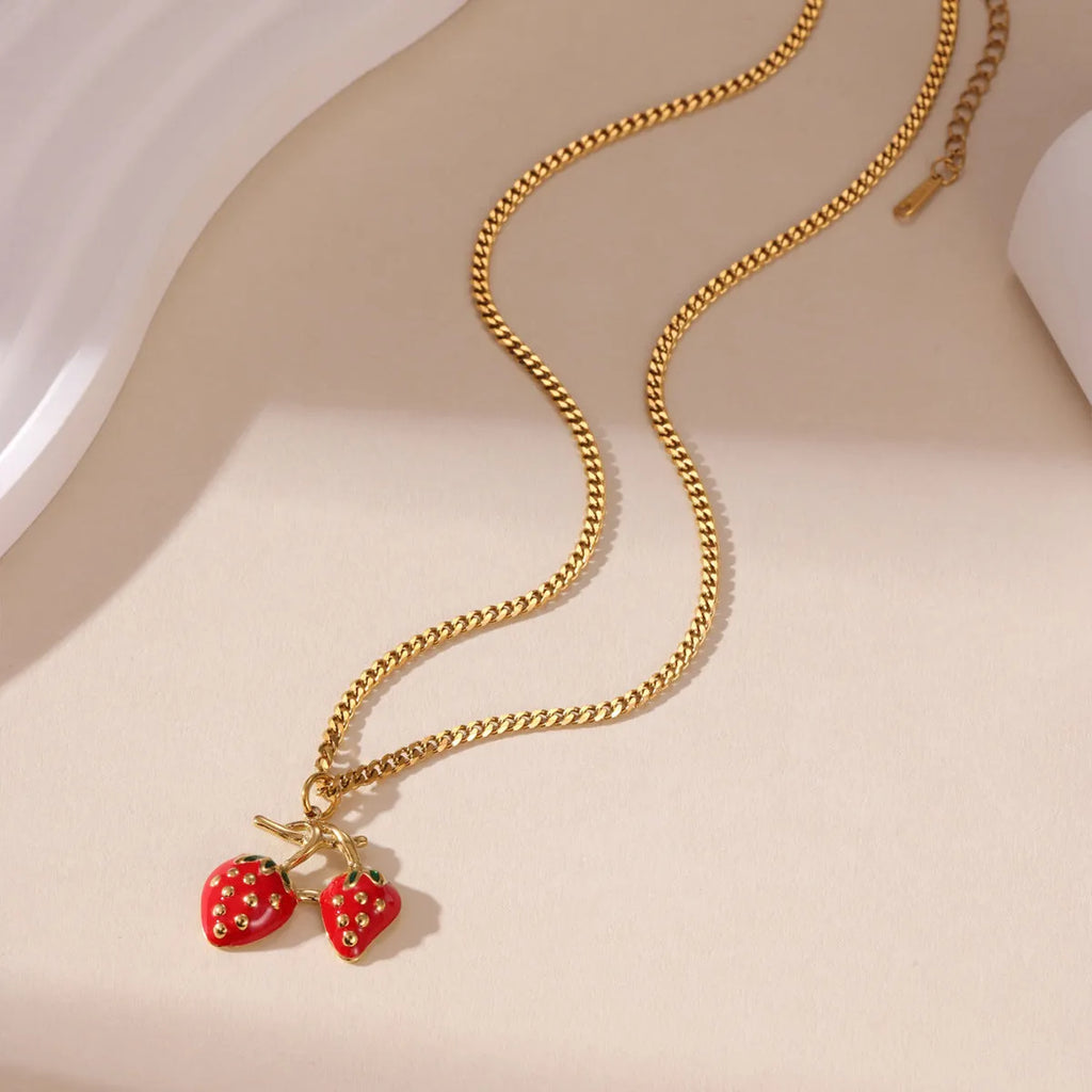 Stainless steel strawberry pendant necklace on adjustable alloy chain in red and white gradient colour options