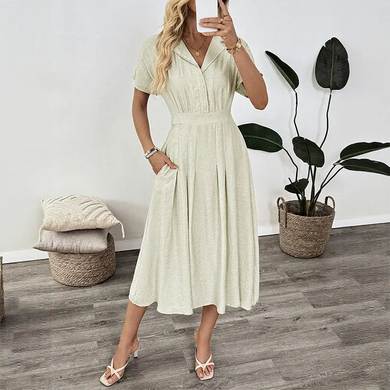 Light green twill shirt dress with lapel, fitted waist and commuter pockets