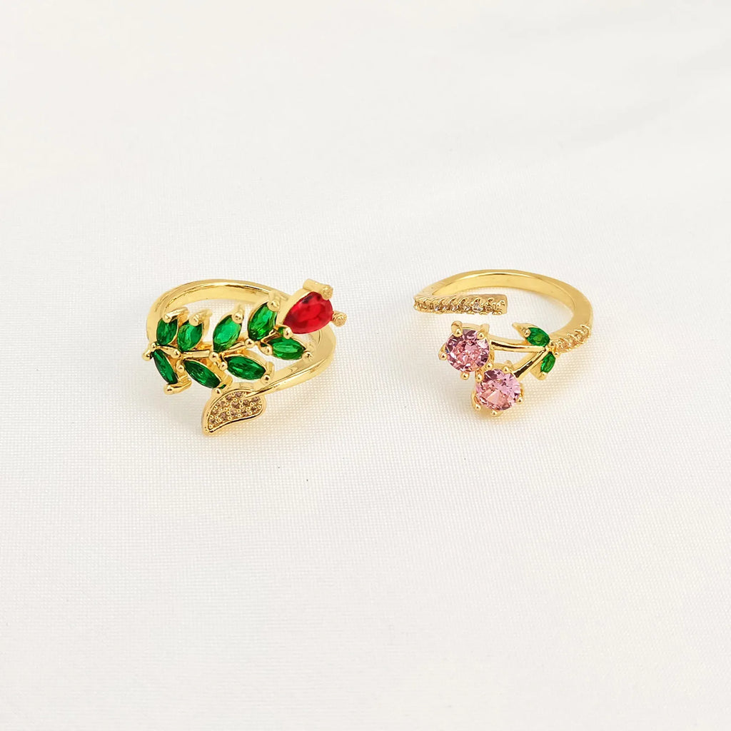 Copper geometric open ring with gold zircon plating and micro-inlaid leaf design, shown in two colours.