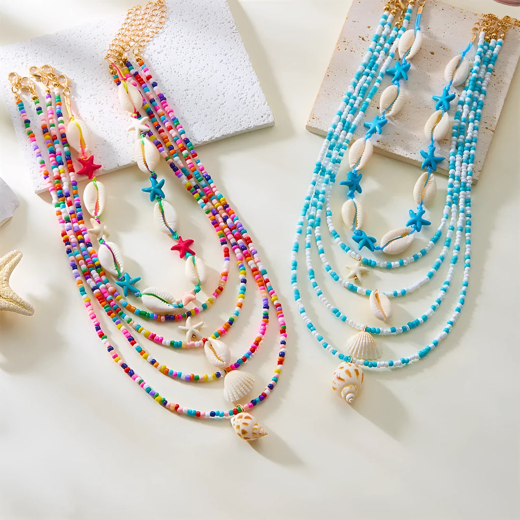 Blue and coloured multi-layer women's necklace set with starfish, shell, and conch beads on adjustable chain.