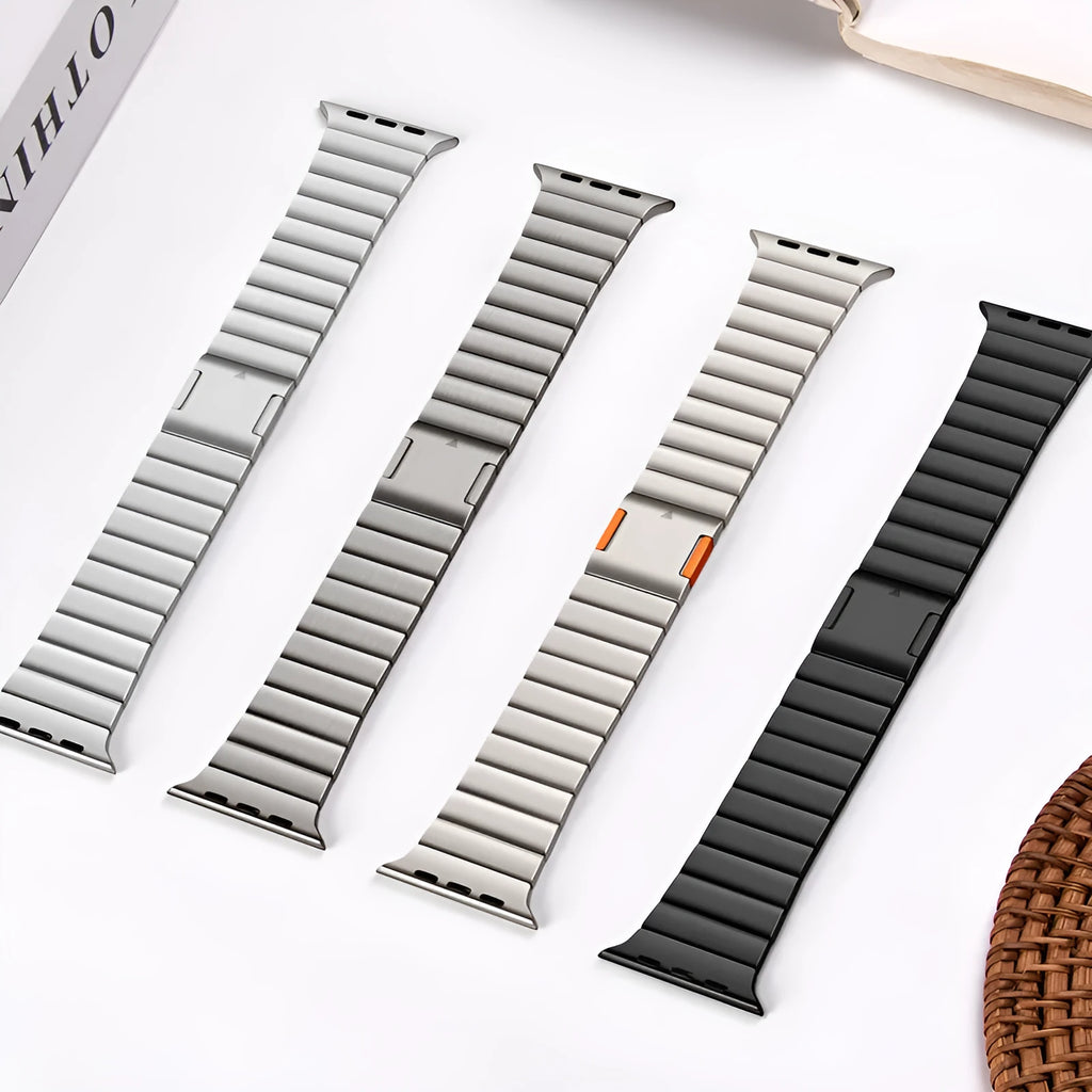 Stainless steel Apple Watch band with magnetic buckle in silver colour on a wrist