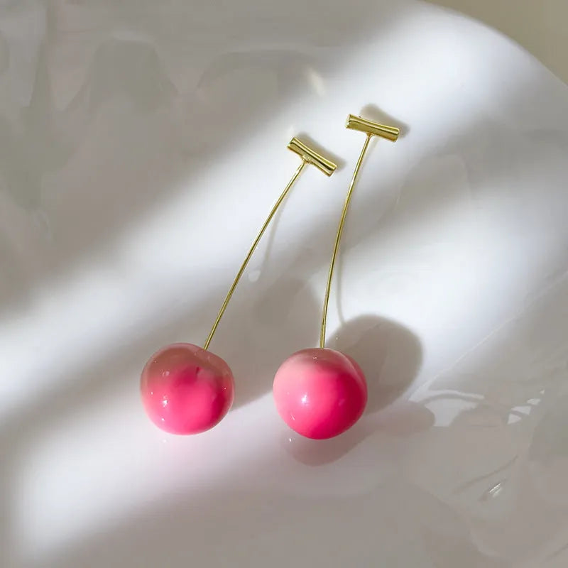 Acrylic peach fruit earrings with gold-tone earwires in small and large size options
