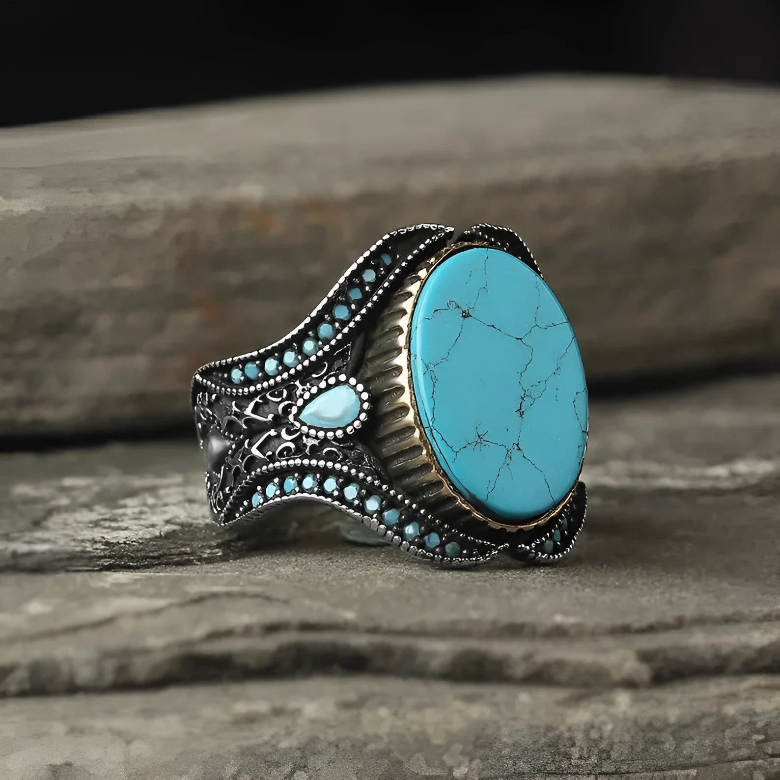 Men's antique silver round turquoise alloy ring on a plain background