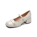 French style hiking boots with patent leather upper, chunky block heel, and buckle fastening in apricot colour