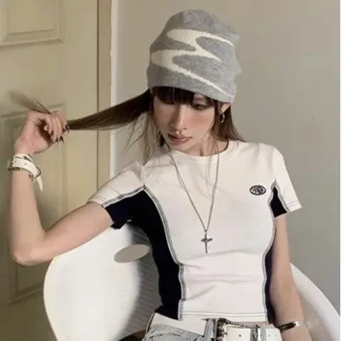 A knitted acrylic beanie hat in medium size, shown in black, grey, and white colour options.