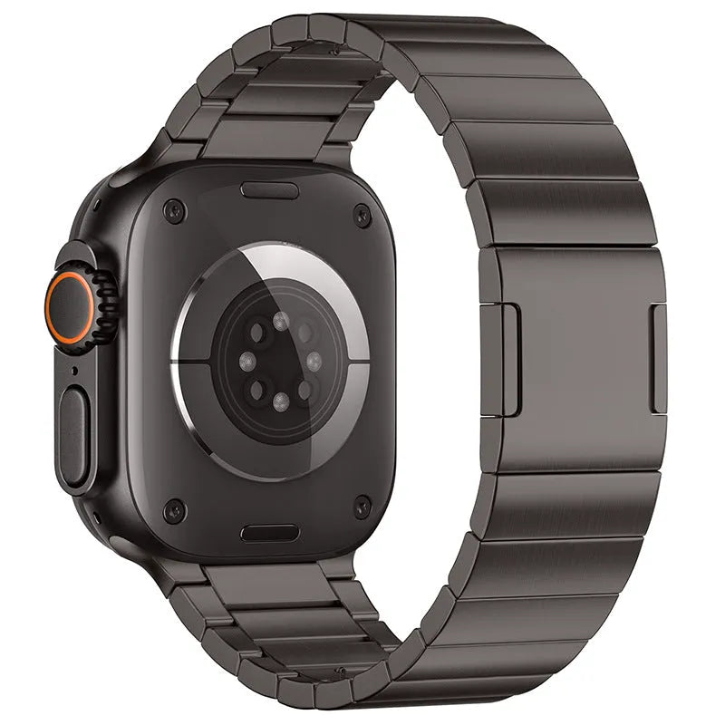 Stainless steel Apple Watch band with magnetic buckle in silver colour on a wrist