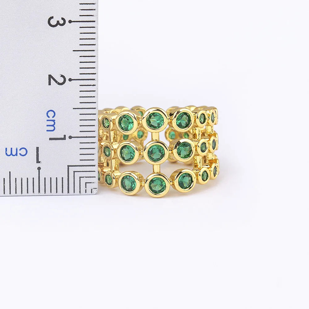 Wide band ring with three layers of green zircon stones and 18K gold plating