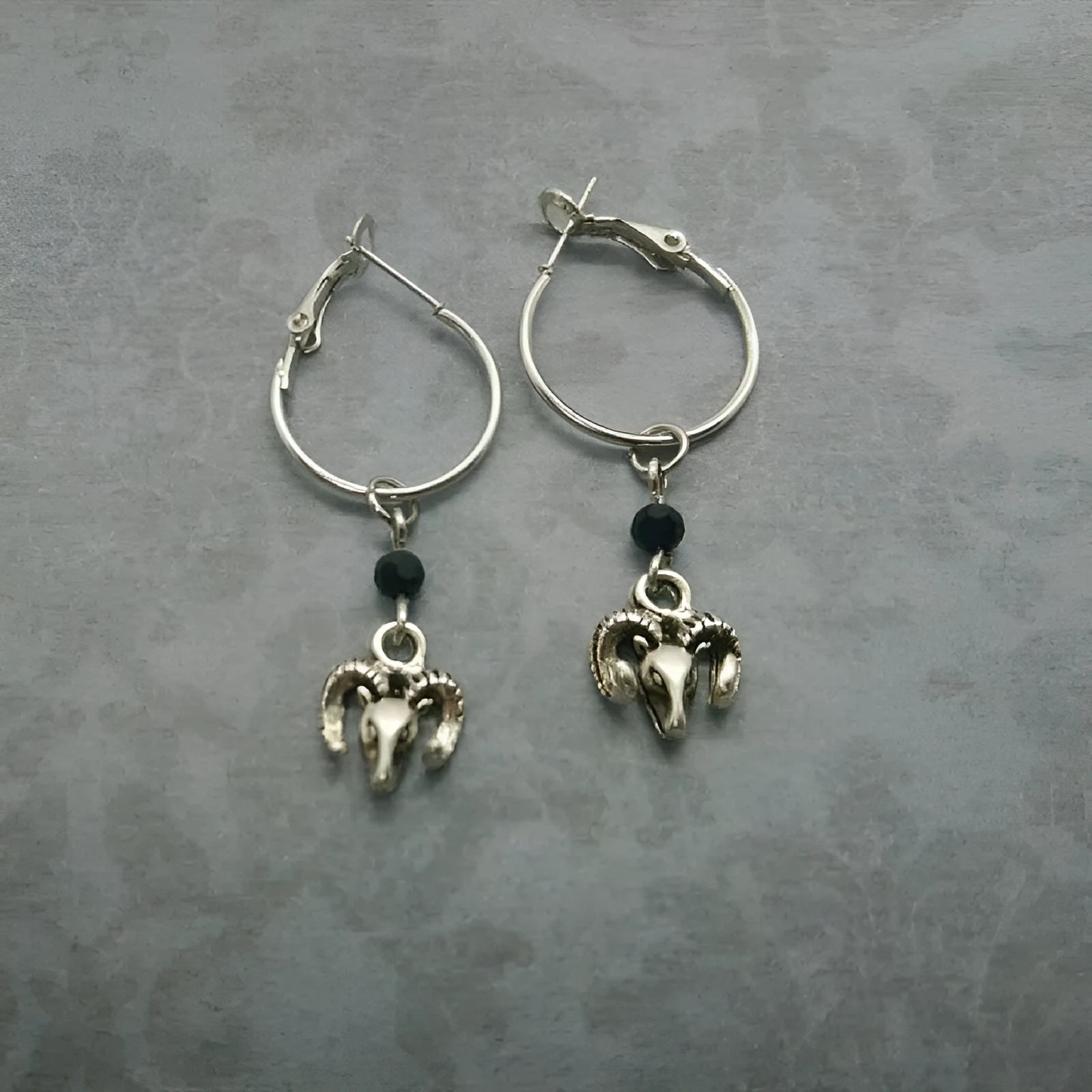 Silver Tibetan antelope round ring earrings for women with Yunnan high altitude inspired design