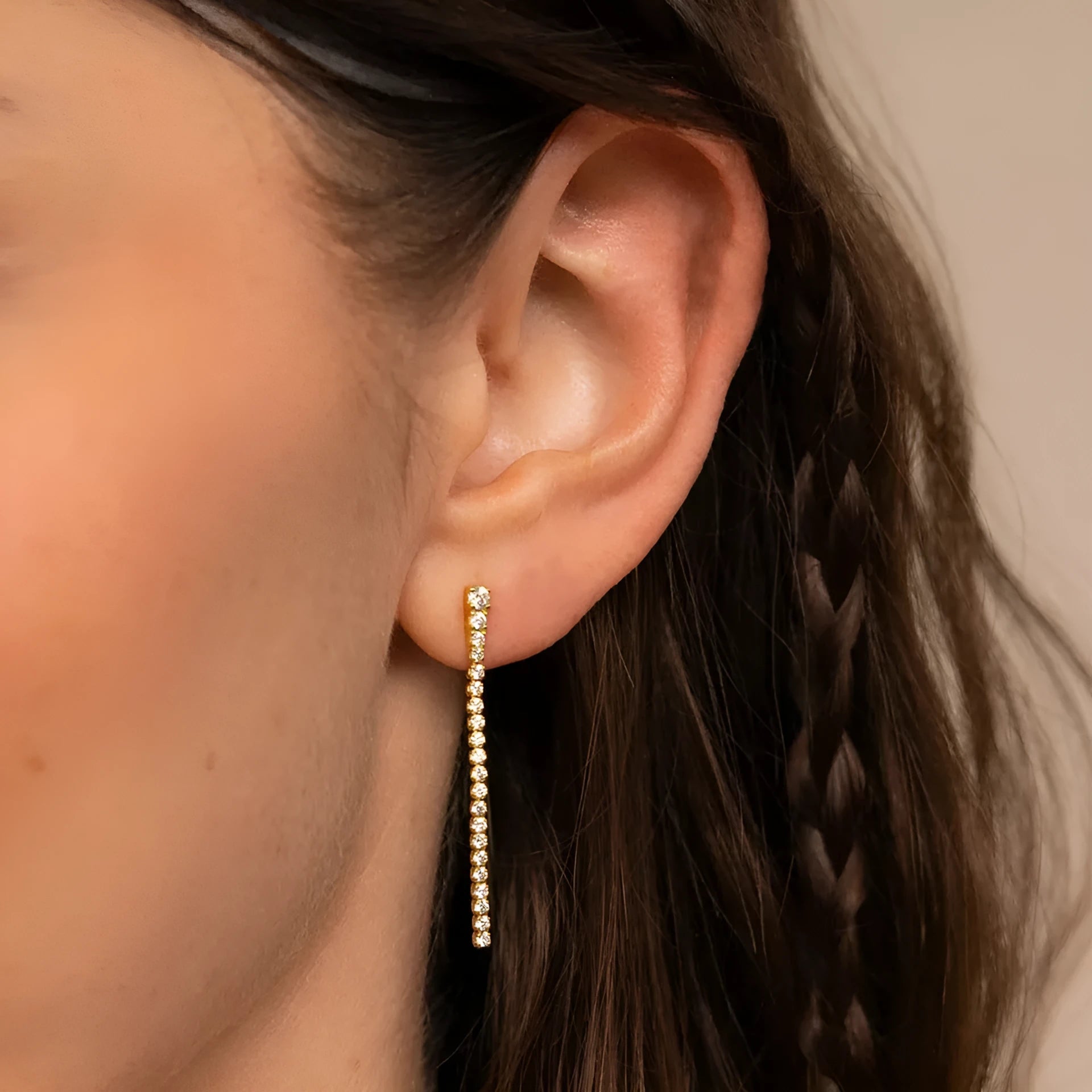 A pair of women's geometric stainless steel earrings with zircon detail in gold and steel colour options.