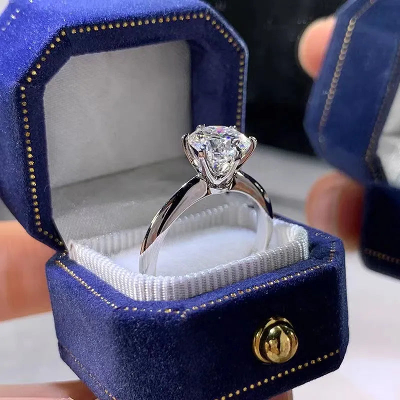 Six-claw set zircon ring with geometric design and white gold plated finish on white copper