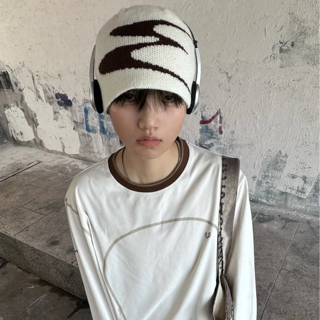 A knitted acrylic beanie hat in medium size, shown in black, grey, and white colour options.