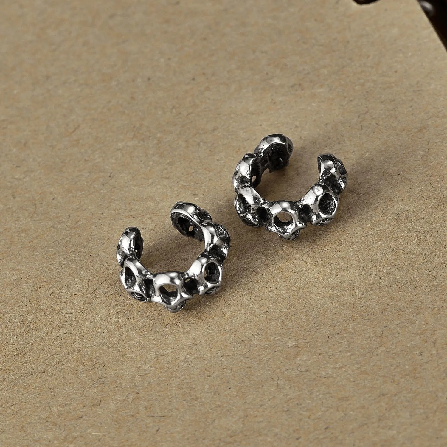 Stainless steel hollow skull ear clips with electroplated finish for men and women