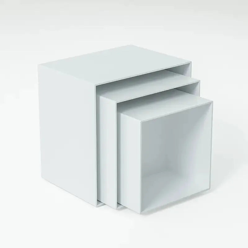 White plastic modular cube dessert display stand with six stackable units for cakes and pastries