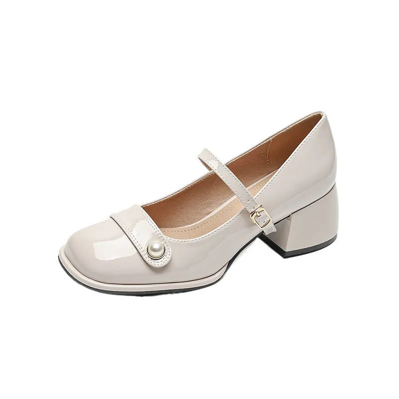 French style hiking boots with patent leather upper, chunky block heel, and buckle fastening in apricot colour