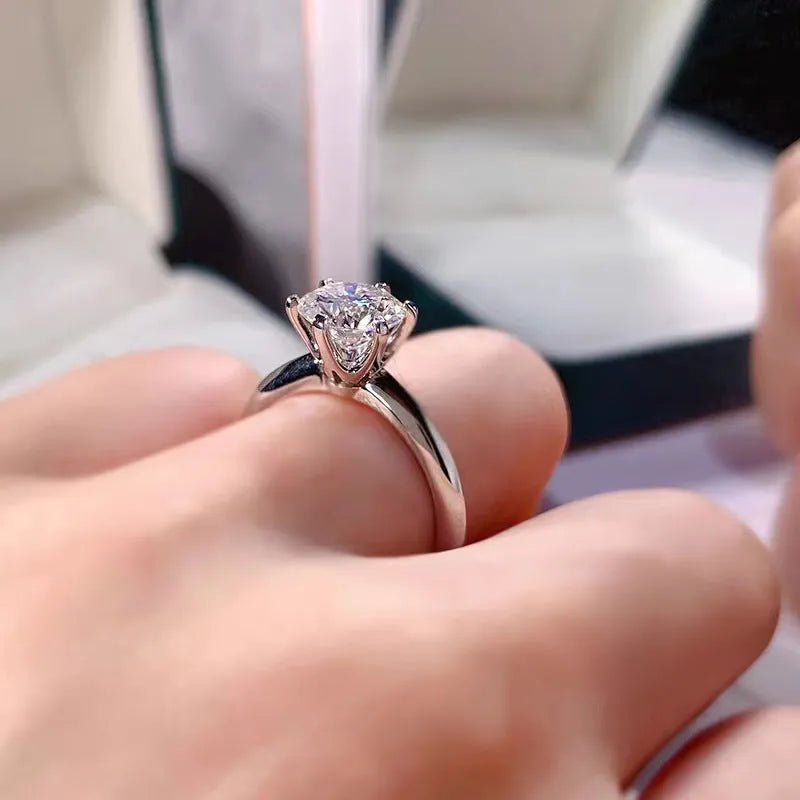 Six-claw set zircon ring with geometric design and white gold plated finish on white copper