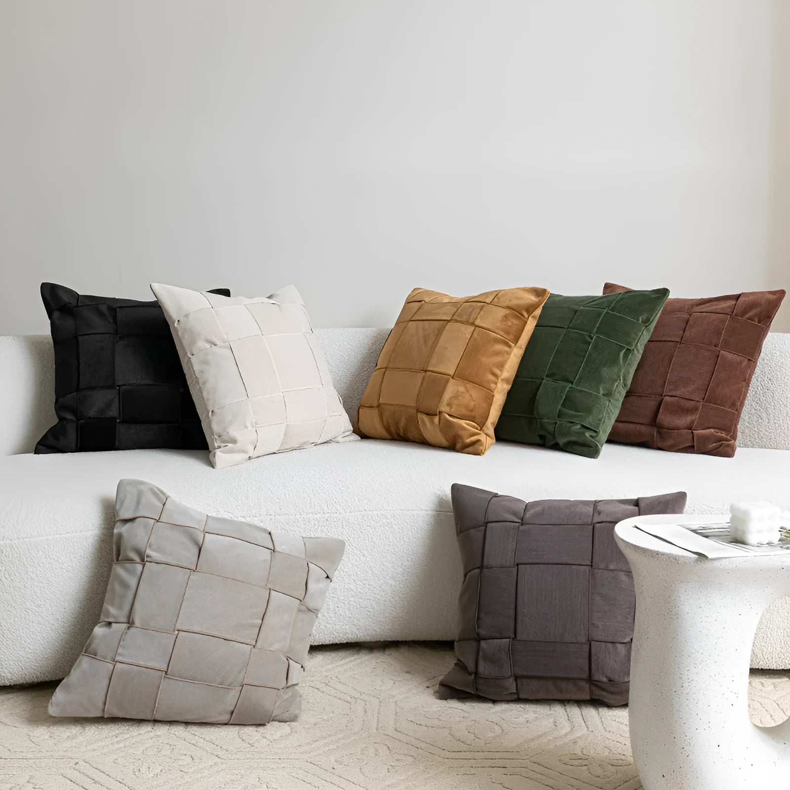 50x50cm square woven chenille pillow cushion on a sofa, shown in a beige colour option.