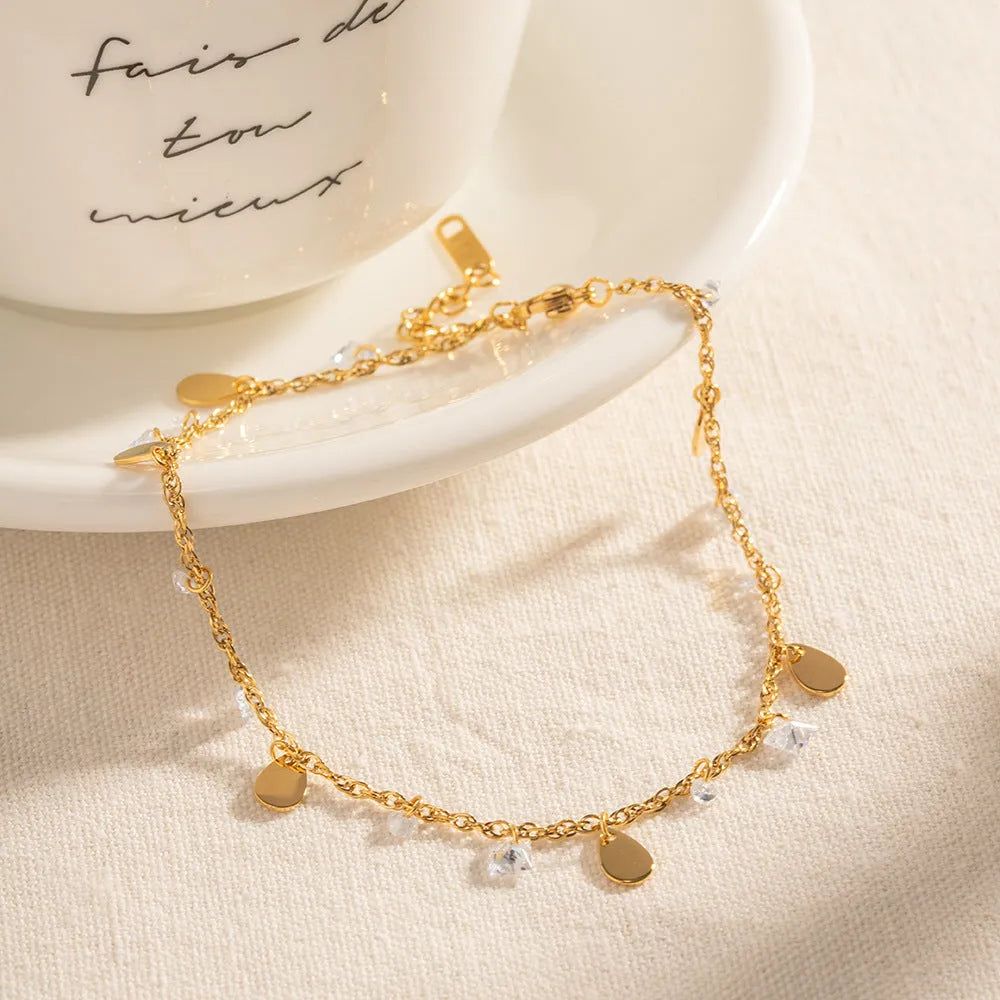 Women's stainless steel anklet with geometric water drop tassel design and adjustable chain
