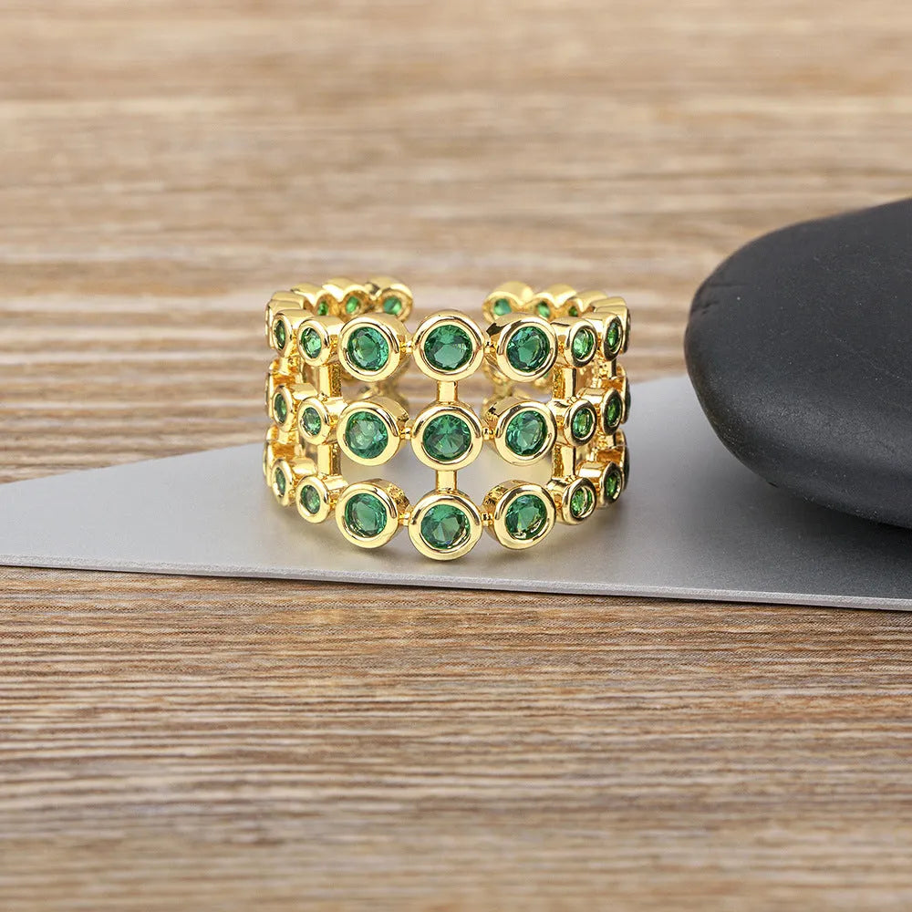 Wide band ring with three layers of green zircon stones and 18K gold plating
