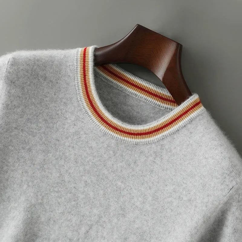 Men's short sleeve pure wool sweater in grey, showing round neck and pullover style on a middle-aged model.